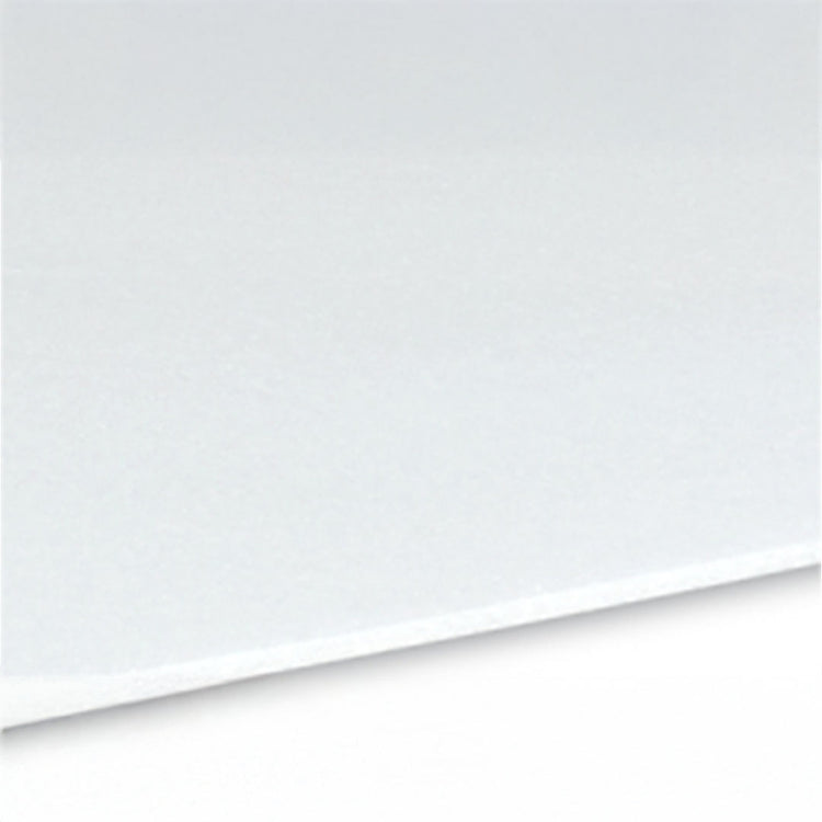 Close-up of a white surface with a slight texture, possibly paper or fabric.