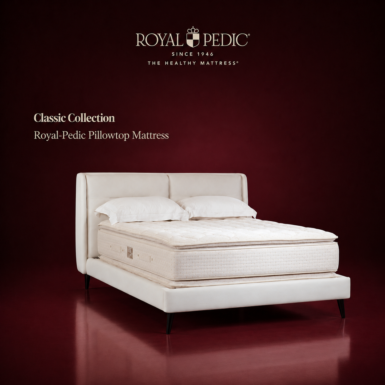 Royal-Pedic Pillowtop Mattress from the Classic Collection on a white bed frame against a dark red background