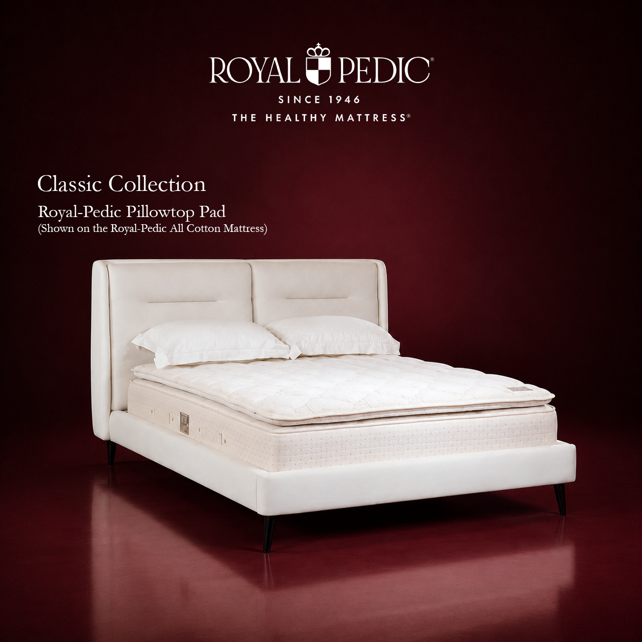 Royal-Pedic Classic Collection pillowtop pad on an all cotton mattress with white headboard and pillows against a dark red background