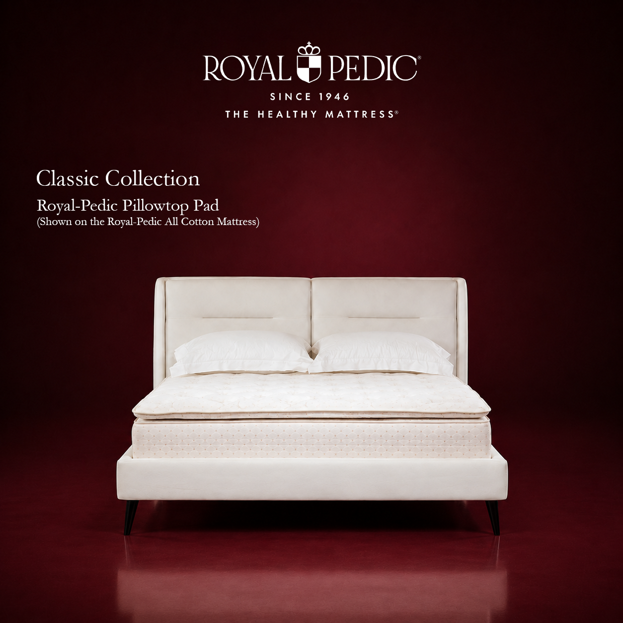 Royal-Pedic Classic Collection pillowtop pad on an all cotton mattress with white pillows and headboard against a dark red background