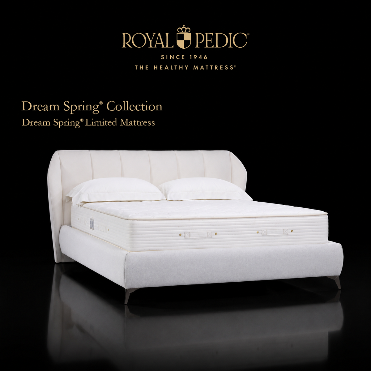 Royal Pedic Dream Spring Limited Mattress on a white upholstered bed frame with a tufted headboard against a black background