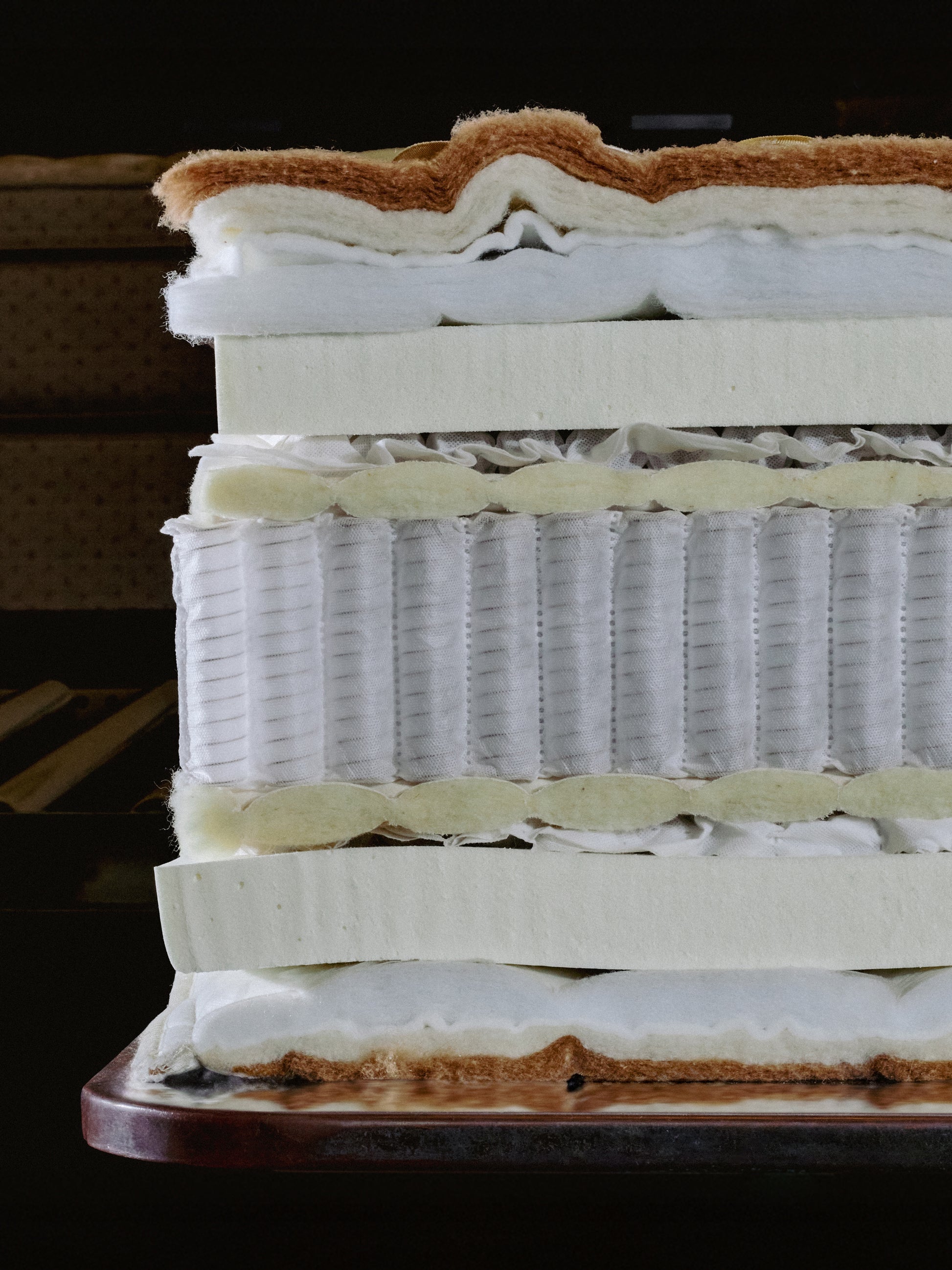 Cross-section of a Royal-Pedic Mattress Dream Spring Ultimate Mattress, revealing layers of natural materials and individually wrapped coils.