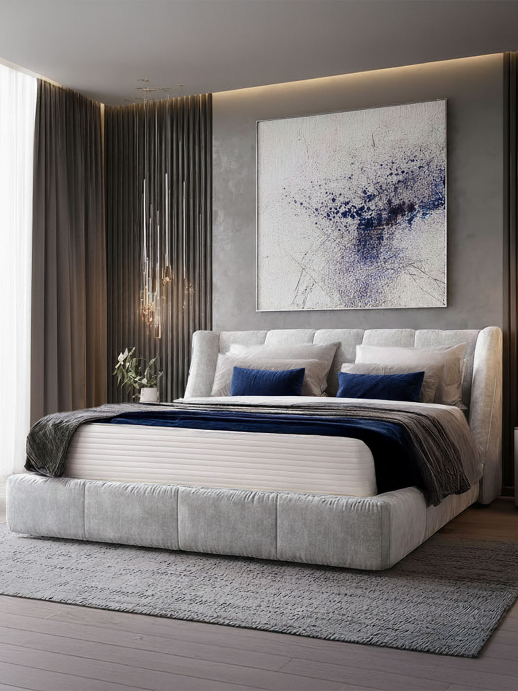 Royalpedic Mattress Nature Spring bed with a light grey upholstered frame, white mattress, blue and grey bedding, and blue pillows in a modern bedroom.