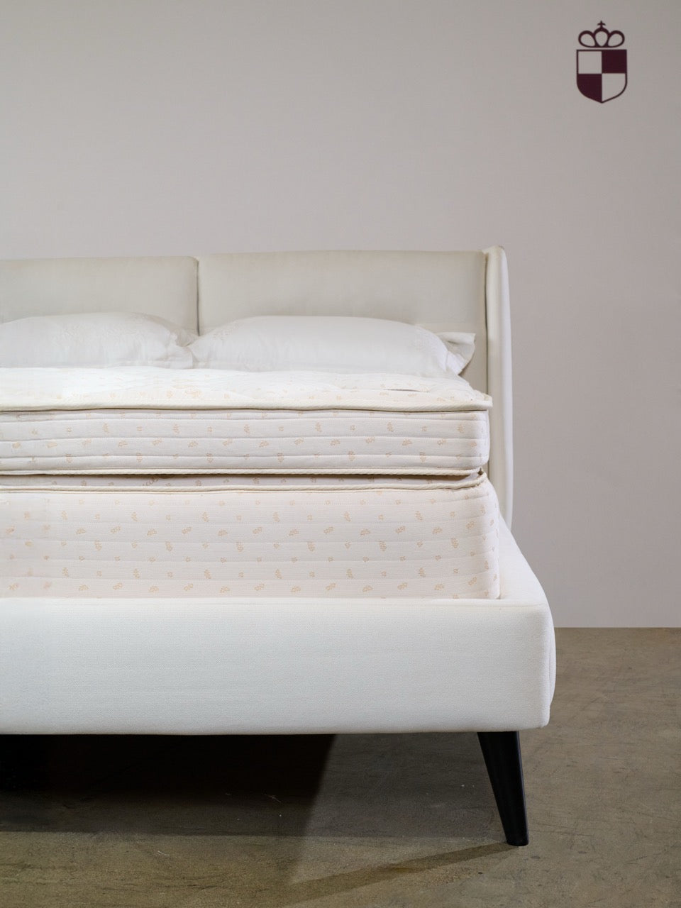 Royal-Pedic & Royal-Cloud Pillowtop Pads on a bed with white pillows and a white headboard. The Royal-Pedic logo is in the top right corner.