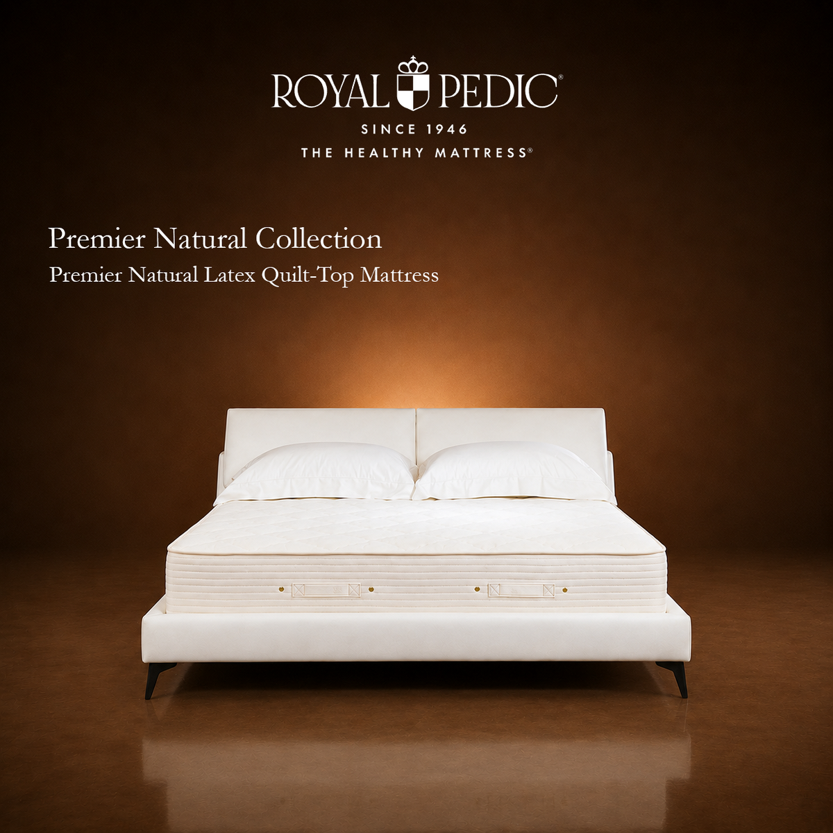 Royal Pedic Premier Natural Latex Quilt-Top Mattress on a white bed frame against a brown background