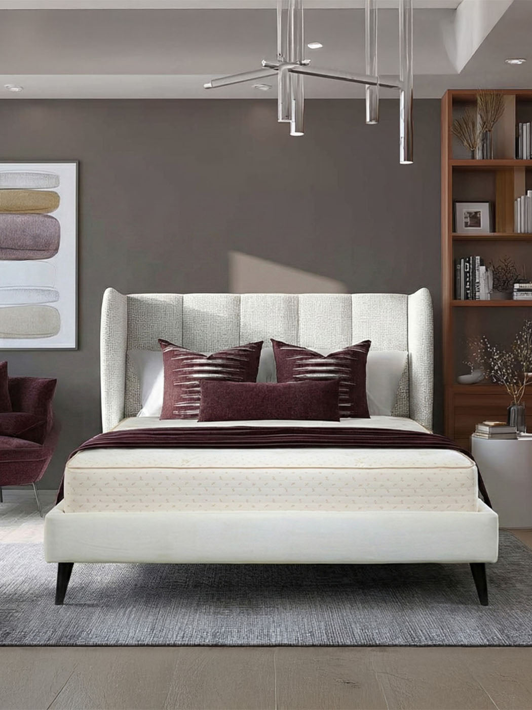 Modern bedroom with a white bed, brown pillows, and a bookshelf.