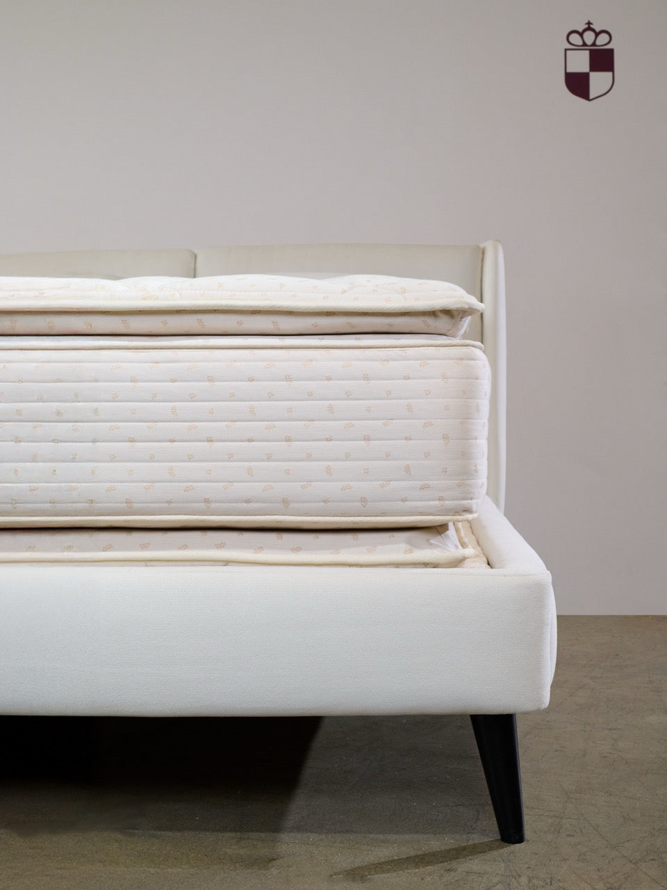 Royal-Pedic Pillowtop Mattress on a bed frame, showing the plush top and quilted side with a subtle pattern. The Royal-Pedic logo is in the top right corner.