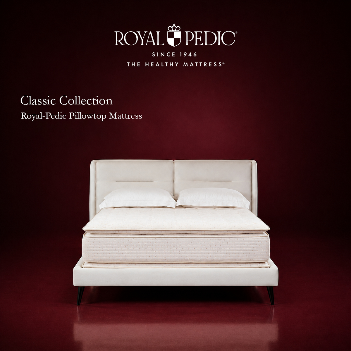 Royal-Pedic Pillowtop Mattress from the Classic Collection on a white bed frame against a dark red background