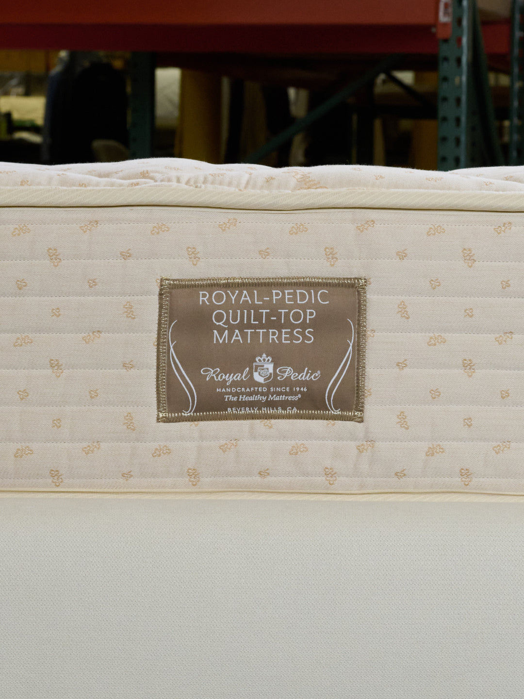 Close-up of a Royal-Pedic Quilt Top Mattress with the brand label visible.